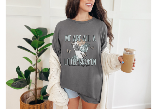 We’re All A Little Broken Tee